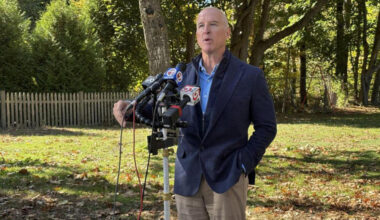 Republican gubernatorial candidate Mike Minouge speaks with reporters on Monday, Oct. 19, 2026 outside the H-W Recreation Center in his hometown of Hamilton. (SHNS)
