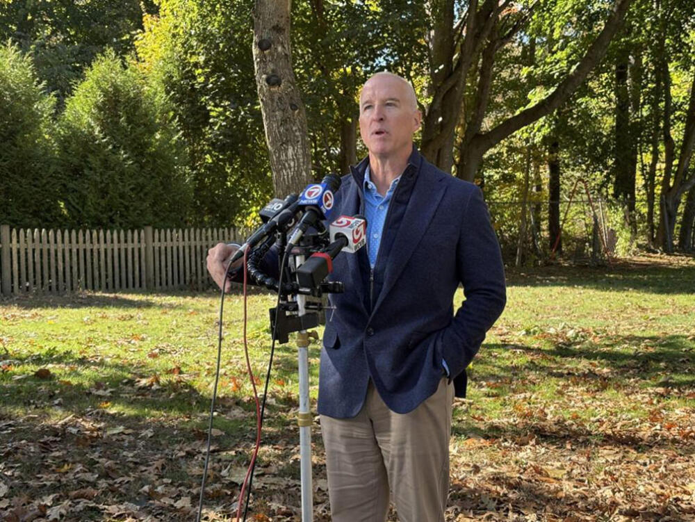 Republican gubernatorial candidate Mike Minouge speaks with reporters on Monday, Oct. 19, 2026 outside the H-W Recreation Center in his hometown of Hamilton. (SHNS)