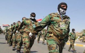 Militias-of-al-Hashd-al-Shaabi-Popular-Mobilization-Forces-march-during-a-military-parade-in-Baghdad-Iraq-on-July-10-2015-Getty-Images