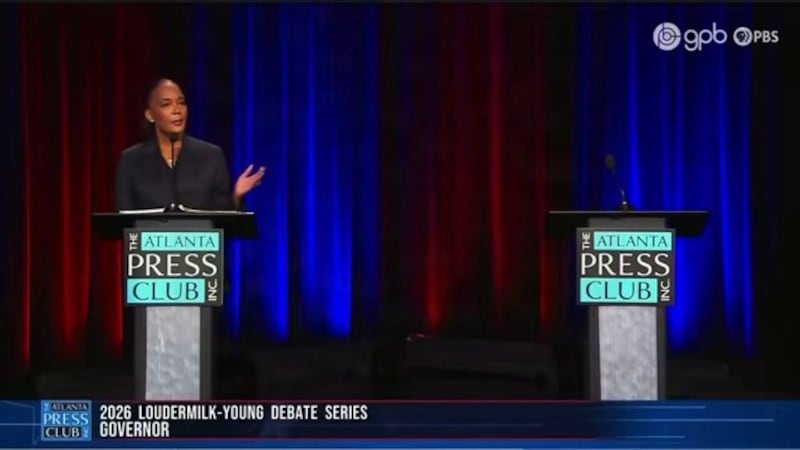 Democratic candidate Keisha Lance Bottoms debates an empty podium.