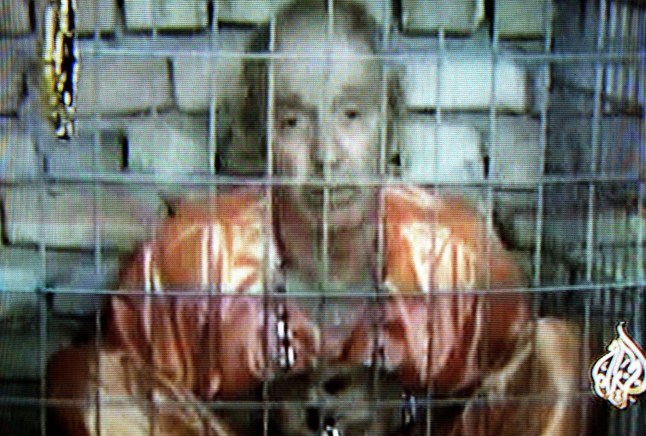 KEN BIGLEY - British hostage Kenneth Bigley in a video tape - aired 29 September 2004 - on Al-Jazeera satellite TV in which he made a fresh plea to Prime Minister Tony Blair to work for his release. The tape showed a sobbing Bigley, dressed in a orange jump suit and kneeling on the floor, talking from behind the bars of what appeared to be a prison cell.