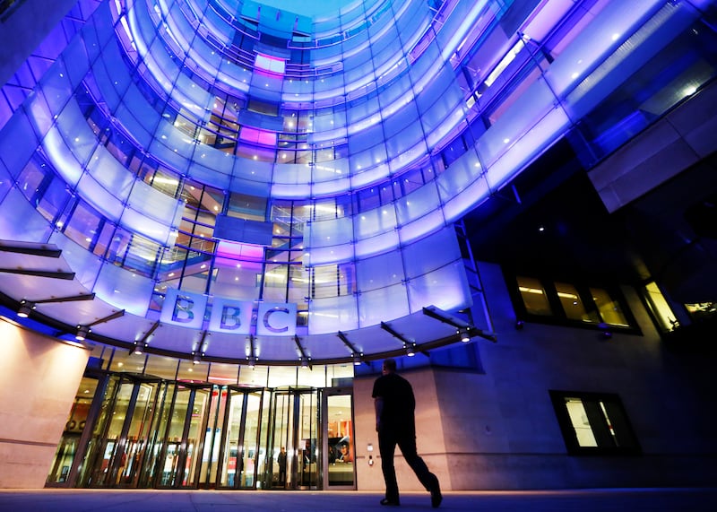 A man enters BBC New Broadcasting House in London November 11, 2012. Britain's BBC could be doomed unless it makes radical changes, the head of its governing trust said on Sunday, after its director general quit to take the blame for the airing of false child sex abuse allegations against a former politician.  REUTERS/Luke MacGregor  (BRITAIN - Tags: MEDIA POLITICS)