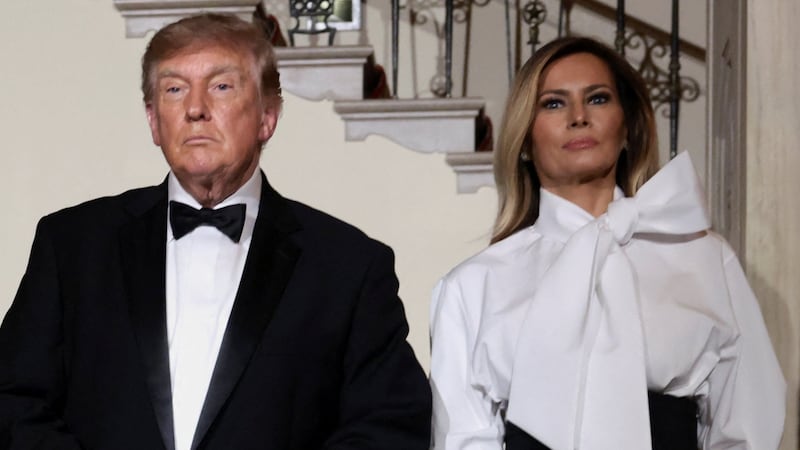 President Donald Trump adjusts his suit as he and first lady Melania Trump prepare to pose with Chinese President Xi Jinping and his wife, Peng Liyuan, at the White House ahead of a state dinner in Washington, D.C., September 24, 2026.