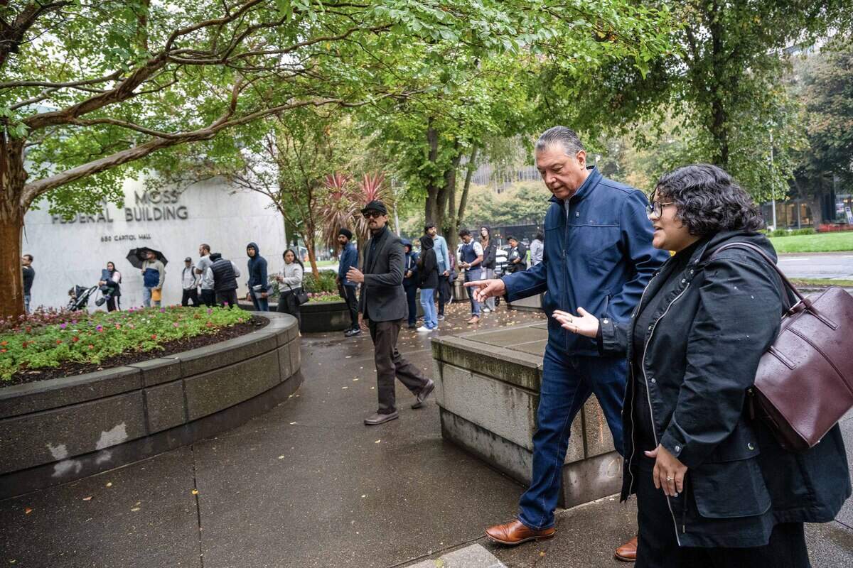 Sen. Alex Padilla chats with Giselle Garcia of NorCal Resist upon arriving at the John E. Moss Federal Building in Sacramento on Thursday, to tour the ICE Enforcement and Removal Operations holding center and monitor conditions inside. Afterward, Padilla said those taken into custody had “a sadness on their faces because they don’t know what’s next.”