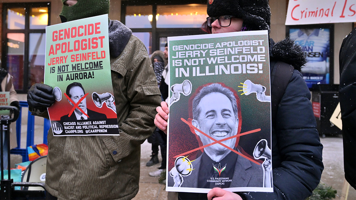 Protesters gather outside theater ahead of Jerry Seinfeld performance.