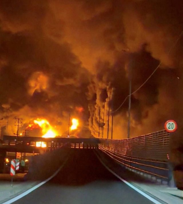 Fire burns and smoke rises from Aqdasieh Oil Depot after being reportedly hit by strike, amid the U.S.-Israeli conflict with Iran, in Tehran, Iran in this screengrab taken from a social media video released on March 8, 2026. SOCIAL MEDIA/via REUTERS THIS IMAGE HAS BEEN SUPPLIED BY A THIRD PARTY. NO RESALES. NO ARCHIVES. VERIFICATION: Reuters confirmed the location as Tehran by the road layout, utility poles and trees which match file and satellite imagery. The date of the video could not be verified, but no older version was found posted online before March 8. Israeli military also wrote on Telegram that it had struck a number of fuel storage facilities in Tehran on March 8. Iran???s state agencies reported attacks on a number of oil depots on March 7. NASA FIRMS detected thermal activity on coordinate 35.790649529257415, 51.539333520742645 at 1:50 a.m. on March 8 (10:20 p.m. UTC March 7). The coordinates were tagged as Petrol Storage Aqdasieh on the online map.