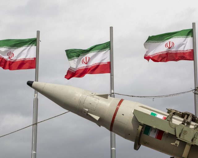 TEHRAN, IRAN - FEBRUARY 11: Missiles produced by Iran's armed forces are displayed near a row of Iranian flags during commemorations to mark the anniversary of the 1979 Iranian Revolution on February 11, 2026 in Tehran, Iran. In that year, Ruhollah Khomeini led an overthrow of the Pahlavi dynasty in 1979 and established himself as Supreme Leader of the Islamic Republic of Iran. (Photo by Majid Saeedi/Getty Images)