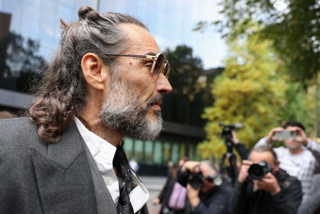 British actor and comedian Russell Brand arrives at Southwark Crown Court where he stands trial on charges of rape and sexual assault involving six women between 1999 and 2009, which he denies, in London, Britain, October 15, 2026. REUTERS/Corey Rudy