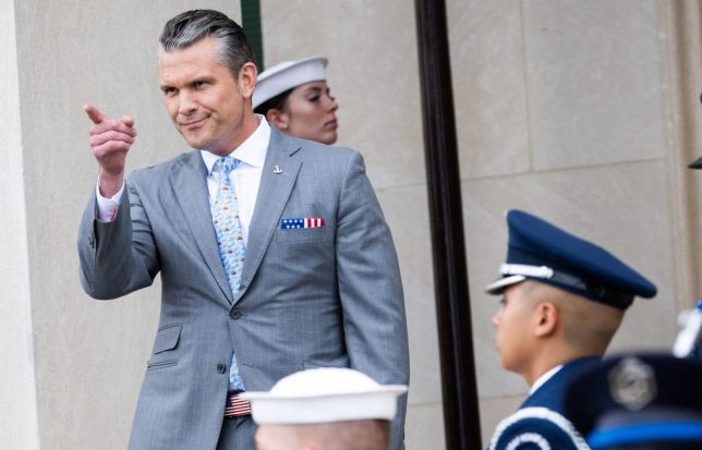 TOPSHOT - US Secretary of Defense Pete Hegseth gestures as he greets British Secretary of Defense Wes Streeting upon his arrival for an honor cordon ceremony ahead of meetings at the Pentagon in Washington, DC, on October 15, 2026. (Photo by SAUL LOEB / AFP via Getty Images)