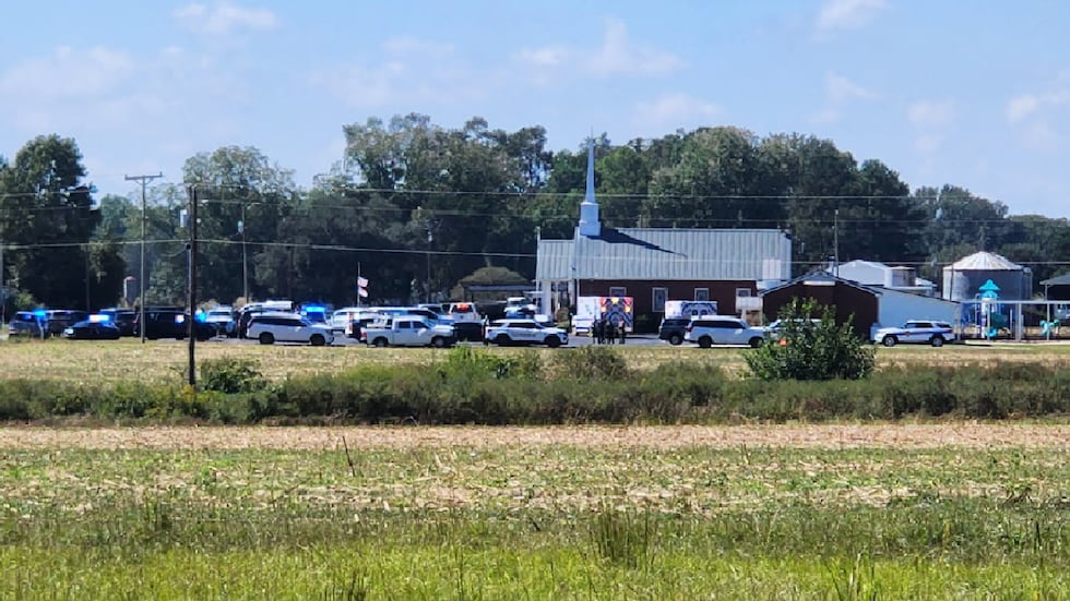 A large law enforcement presence is seen at a church on Jonestown Road.