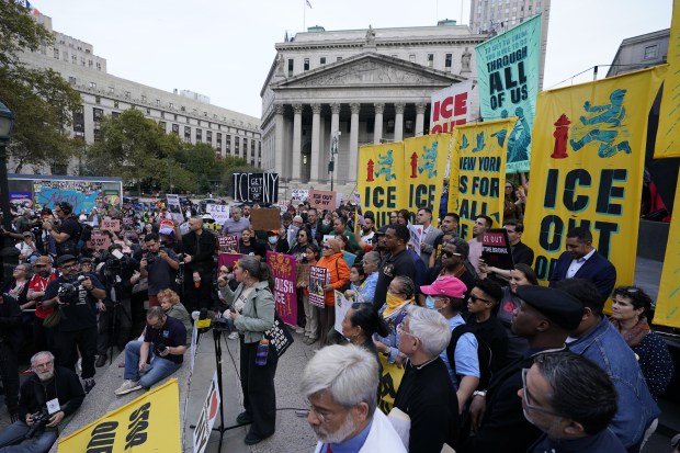 Demonstrators gather at Foley Square in Manhattan on Friday night to protest the ICE shooting of Oscar Belgal.