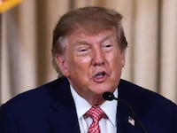 President Donald Trump speaks next to President of OpenAI Greg Brockman during a MAGA inc. dinner at his Mar-a-Lago estate in Palm Beach, Florida, October 17, 2026.