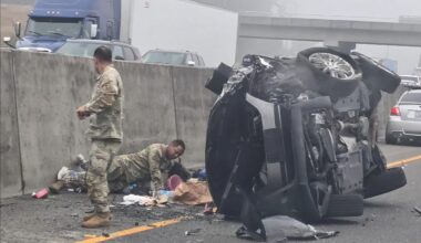 Woman allegedly stabs girl after SUV hits semi as soldiers step in to stop horrific roadside attack