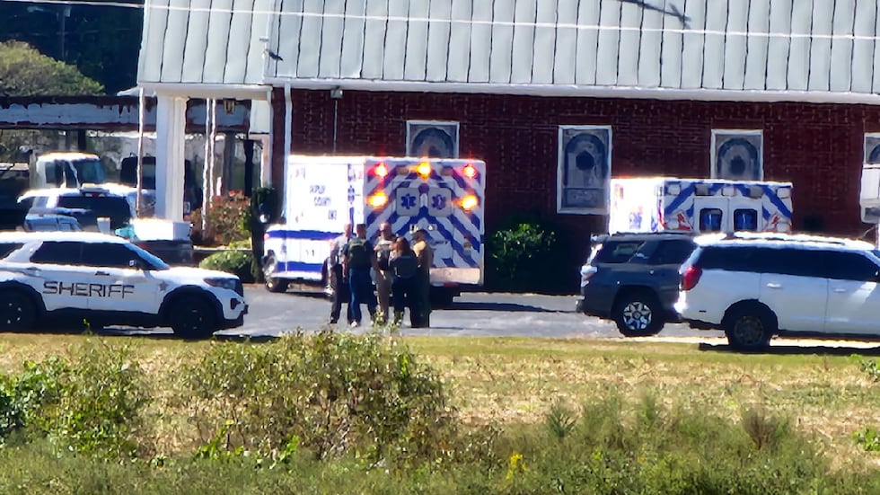 A large law enforcement presence is seen at a church on Jonestown Road.