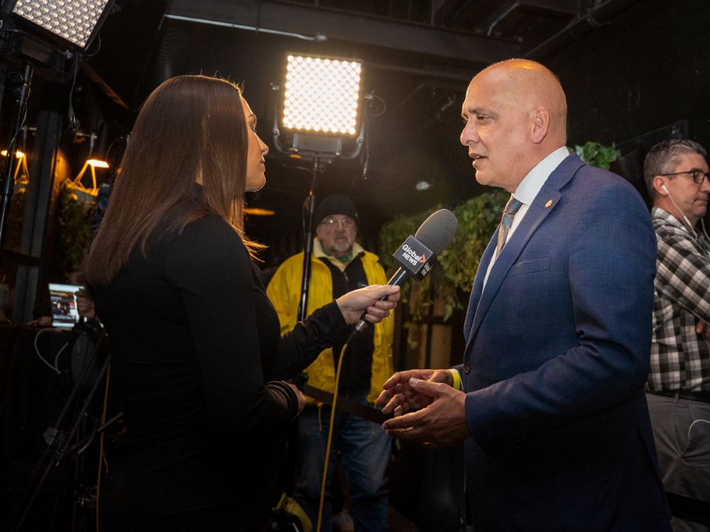 Pete Fry talks to a reporter.
