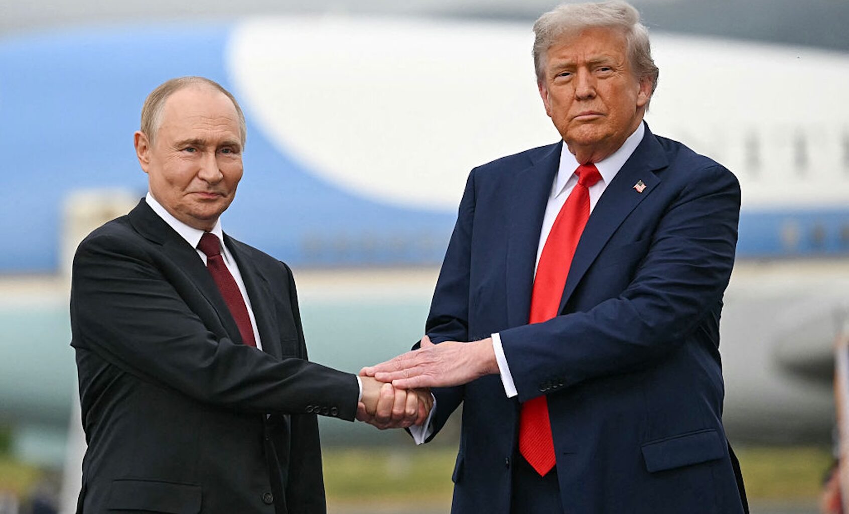 President Donald Trump greets Russian President Vladimir Putin in Anchorage, Alaska, for a summit meeting on Russia's war on Ukraine. (ANDREW CABALLERO-REYNOLDS / AFP)