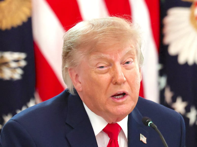 US President Donald Trump speaks about foreign fraudulent cryptocurrency investment schemes and his administration's efforts to prevent them during a round table at the White House in Washington, DC, US, October 21, 2026.