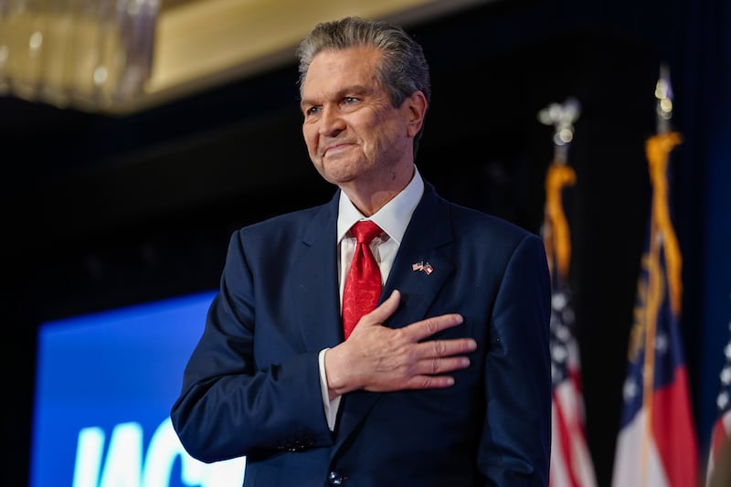 Republican gubernatorial candidate Rick Jackson holds his hand over his heart as he takes the stage at his election night watch party on May 19, 2026 in Atlanta, Georgia after it became clear he would advance to the runoff against Lieutenant Governor Burt Jones.