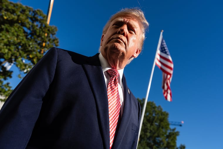 Donald Trump speaks to reporters outside the White House on Monday. The president's apparent plan to bomb Iran again, after the midterms, is dangerous and foolish, writes Trudy Rubin.