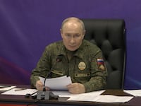 Russian President Vladimir Putin visits a command post of Russia's joint force grouping, in the course of the Russia-Ukraine conflict, at an unidentified location, in this still image taken from a video released on October 16, 2026.