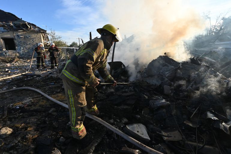 TOPSHOT - Firefighters extinguish a fire at a house following air strikes in Kharkiv on October 2, 2026, amid the Russian invasion of Ukraine.