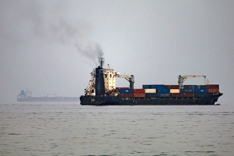 The Panama-flagged container shipping vessel Ten Neptune transits the Gulf of Oman off the coast of Khor Fakkan in the emirate of Sharjah in the east of the UAE on October 13, 2026.