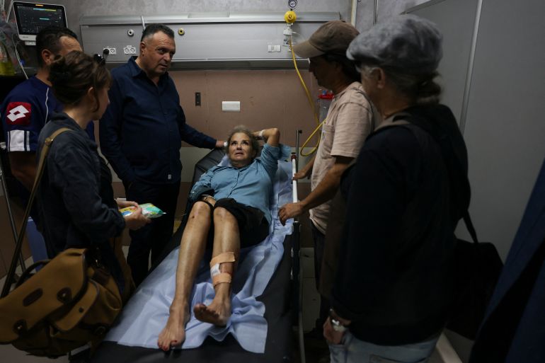 American freelance photojournalist Heidi Levine lies on a gurney in the emergency room of the government hospital in the Israeli-occupied city of Ramallah, as she is treated after being attacked by Israeli settlers while photographing Palestinian farmers harvesting their olives, in the Palestinian village of Abu Falah on October 16, 2026.