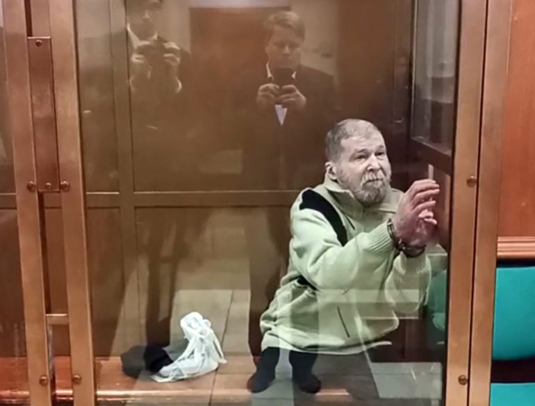 (FILES) In this grab from a handout footage taken and released by the Moscow City Court press service on October 7, 2024, US citizen Stephen Hubbard, 72, accused of fighting as a mercenary for Ukraine, attends his verdict hearing in Moscow.