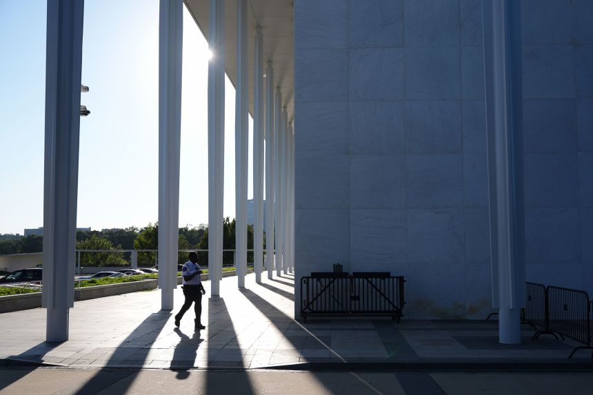 A security official walks outside of the John F. Kennedy Center for the Performing Arts in Washington, DC, on September 15, 2026.