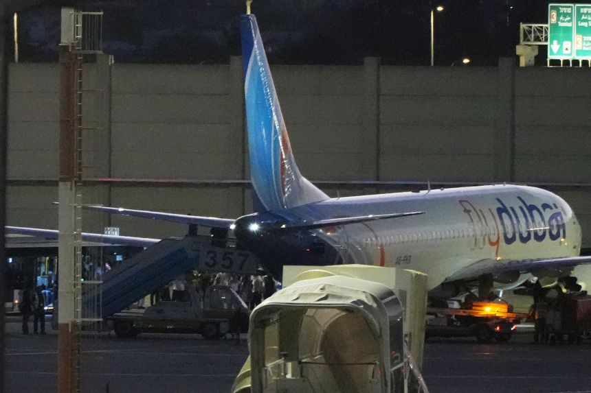 People disembark from a Flybubai carrying Israeli passengers who had earlier been aboard another FlyDubai aircraft that made an emergency landing in Saudi Arabia approaches Ben Gurion International Airport, Israel, Wednesday, Sept. 30.