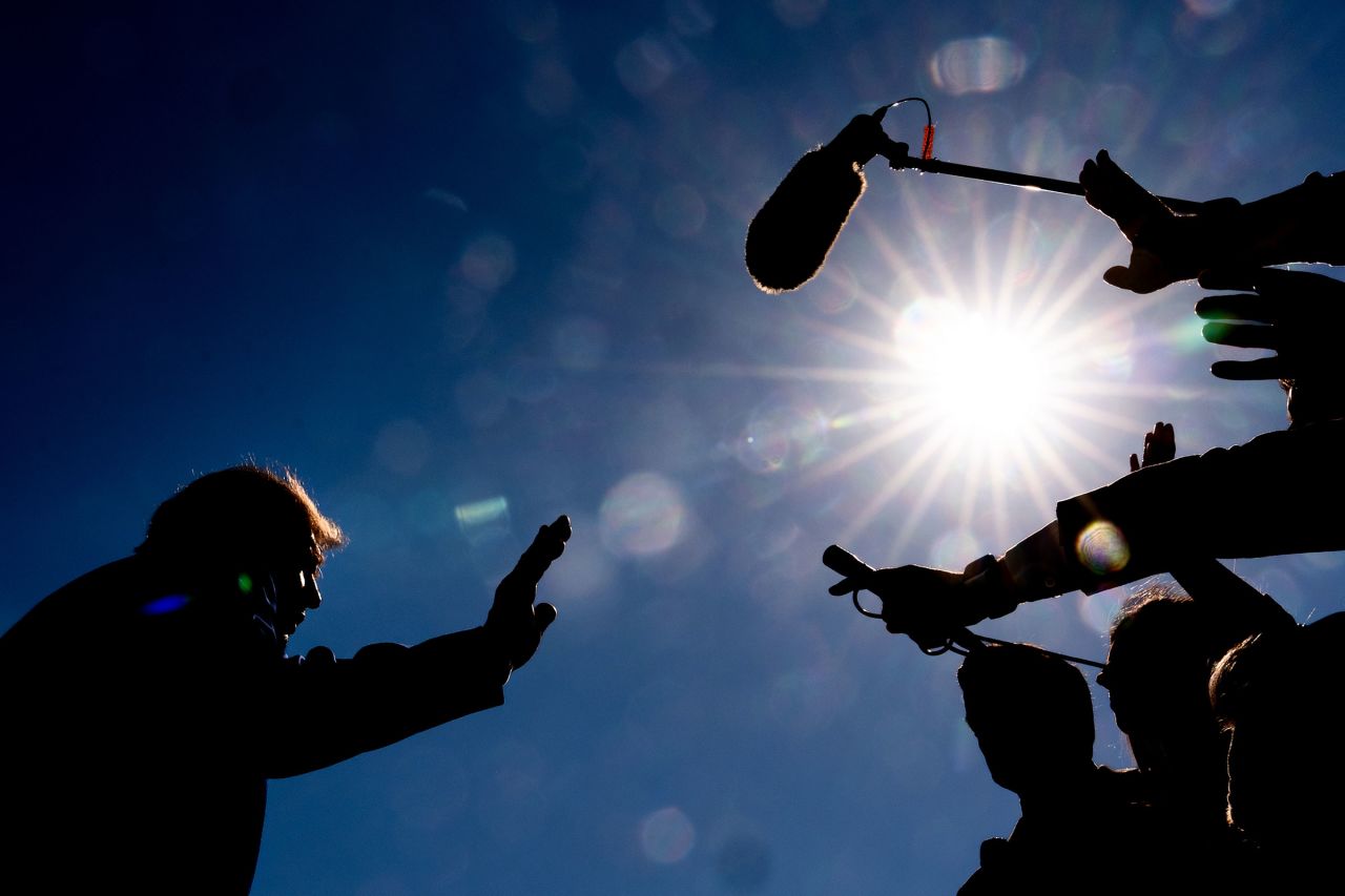 President Donald Trump speaks with reporters before boarding Marine One on the South Lawn of the White House, on Wednesday.