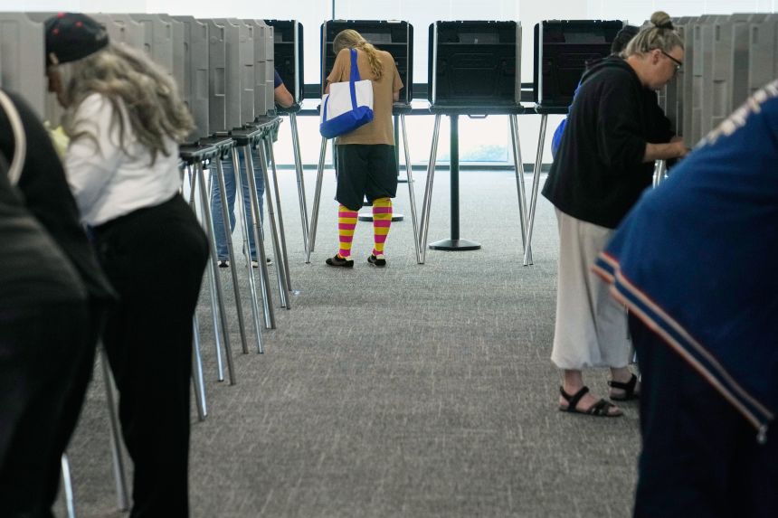 Voters fill in their ballots in privacy booths during early in-person voting in Cleveland on Wednesday, Oct. 7, 2026.