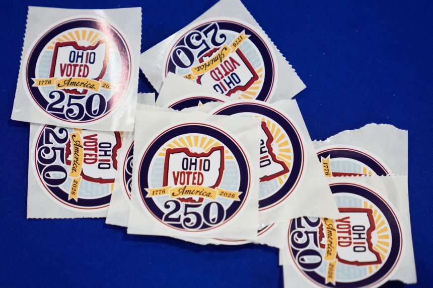 Voters receive stickers at early in-person voting in Cleveland on Wednesday, October 7, 2026.