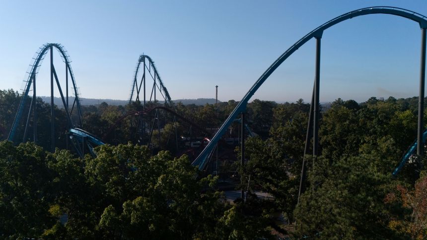 Attractions are seen at Six Flags Over Georgia, about 15 miles (24 kilometers) northwest of Atlanta, Tuesday, Oct. 13, 2026. (AP Photo/Mike Stewart)