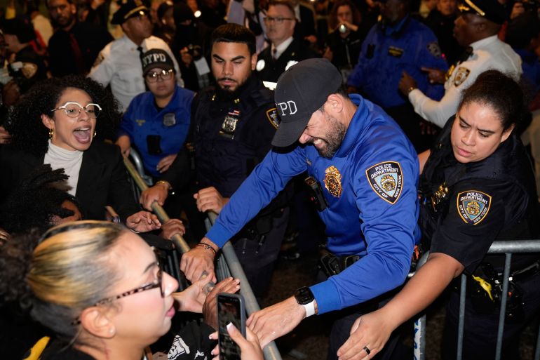 Protesters scuffle with police near the scene of the shooting of a man by an ICE agent in New York on October 8, 2026