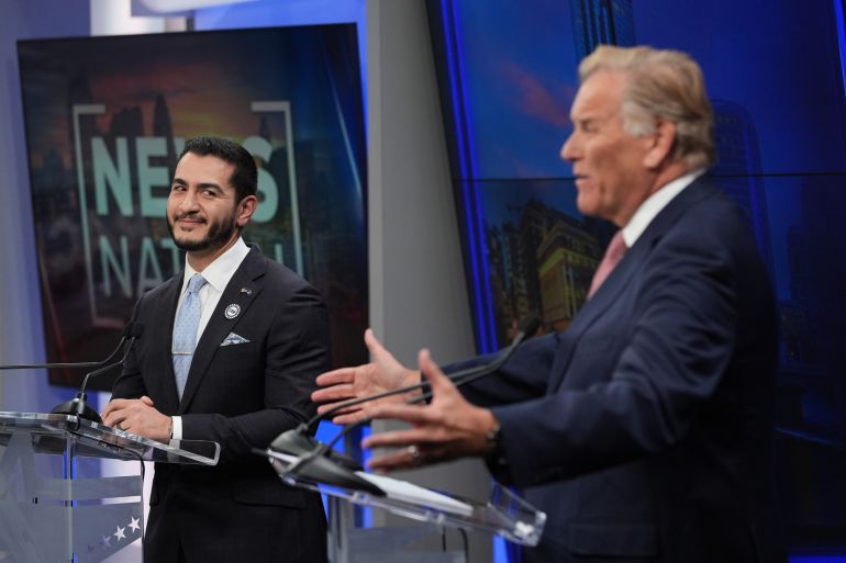 Republican nominee for U.S. Senate Mike Rogers, right, speaks during a televised debate with Democratic nominee for U.S. Senate Abdul El-Sayed, at WOOD-TV, on Thursday, Oct. 8, 2026, in Grand Rapids, Mich. (AP Photo/Paul Sancya, Pool)