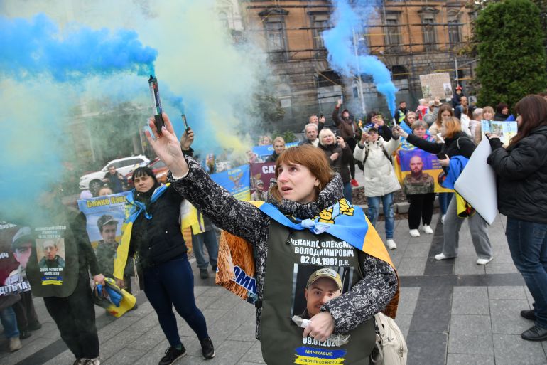 People attend a rally demanding to free Ukrainian prisoners of war who are held in captivity in Russia in Lviv, Ukraine, Saturday, Oct. 17, 2026. (AP Photo/Mykola Tys)