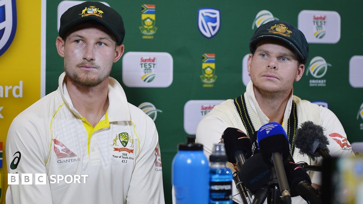 Cameron Bancroft is seen hiding a yellow piece of sandpaper down his trousers