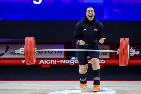Reyhaneh Karimi celebrates after a successful attempt in the women’s 77kg weightlifting event, where she won bronze.