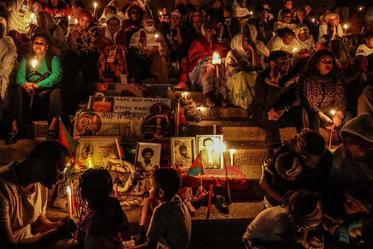 People sit as they hold candles during a vigil ahead of Martyrs' Day, which commemorates the sacrifices made by Eritreans who lost their lives during the Eritrean War of Independence, in Asmara, Eritrea, June 19, 2026. Eritrea has long been isolated by the West, which views the East African country as among the most repressive in the world, while the government in Asmara has itself pursued a policy of political and economic seclusion. Despite its small population, Eritrea has gained new geopolitical importance this year, during the Iran war, because of its 1,000-km Red Sea coastline along a key shipping route between the Mediterranean and Asia. As conflict disrupted traffic through the Strait of Hormuz and attacks by Iran-backed Houthi militants threatened vessels near Yemen, Eritrean waters emerged as potentially one of the safest corridors for maritime trade. REUTERS/Monicah Mwangi