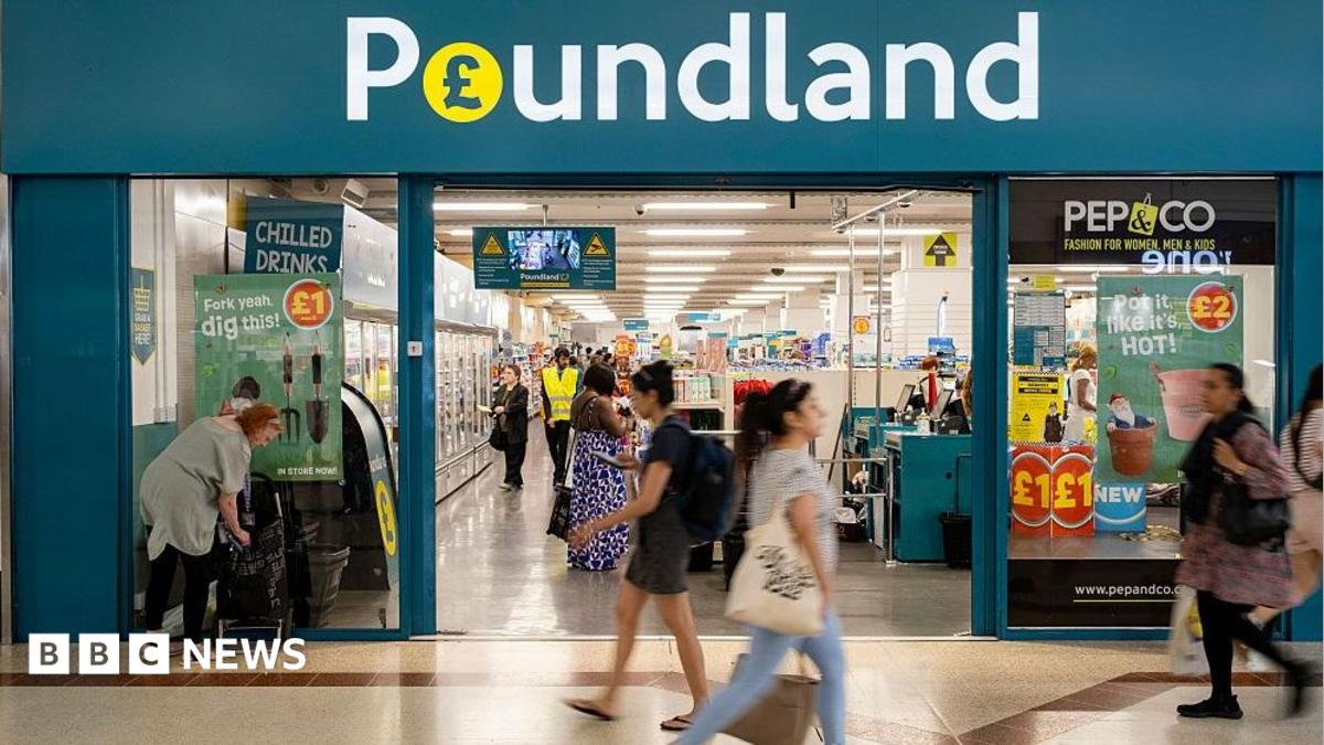 Exterior shot of a Poundland store with people walking past it