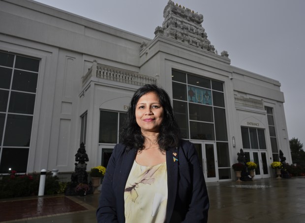 Aurora Ald. Shweta Baid stands in front of the Sri Venkateswara Swami Balaji Temple in Aurora, Oct. 15, 2026. Baid said her reaction was utter disbelief about the attempted mass shooting at her hometown Hindu temple. (John Starks/Daily Herald)
