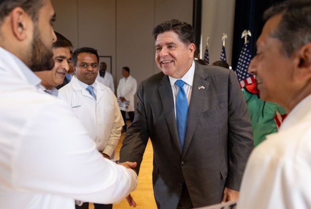 Gov. JB Pritzker greets health care workers after accepting endorsements during a campaign event, Oct. 14, 2026, at the University of Illinois Chicago. (Brian Cassella/Chicago Tribune)