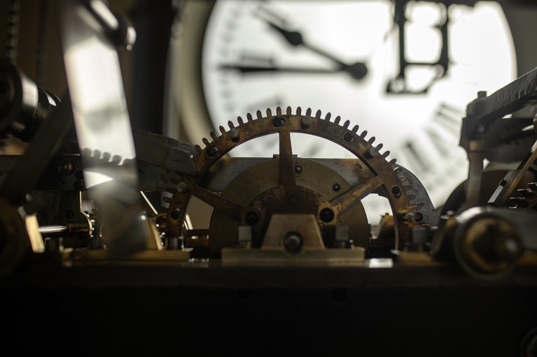 Close-up view of the clock mechanism in a mechanical clock.