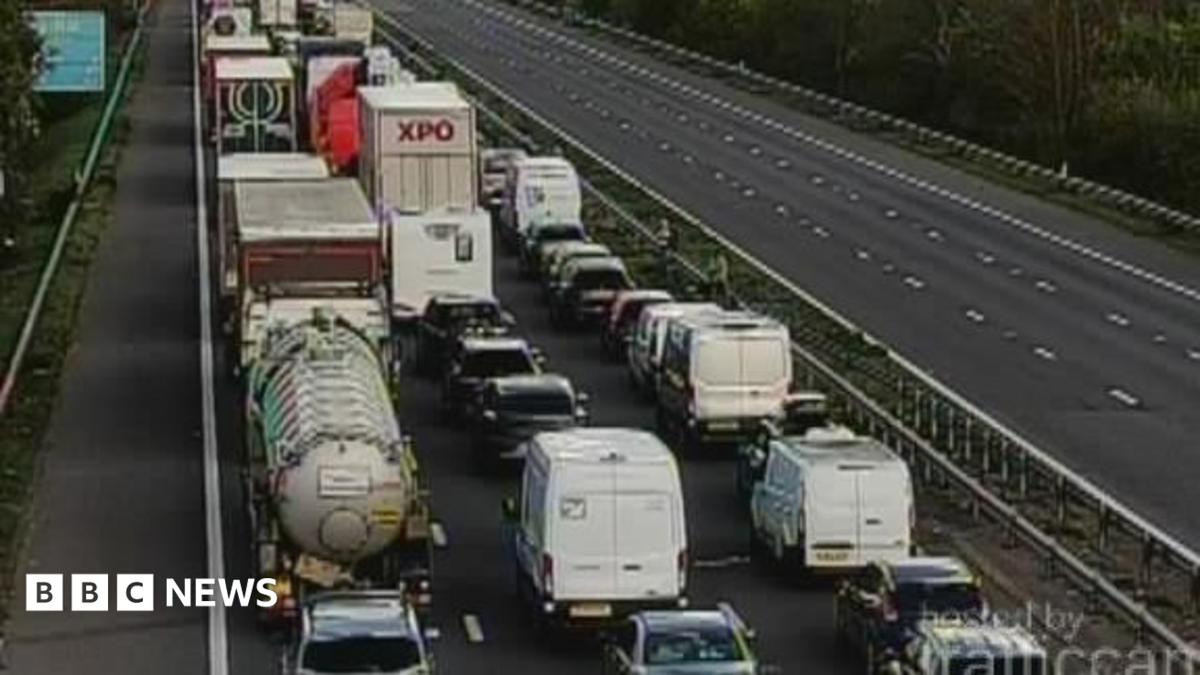 A CCTV image showing traffic backed up on the northbound lane of the motorway, while the southbound lanes are completely empty.
