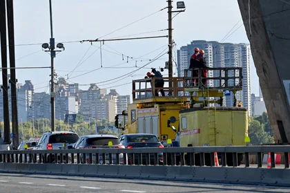 Russian Drone Debris Falls Across Kyiv, Setting Cars Ablaze