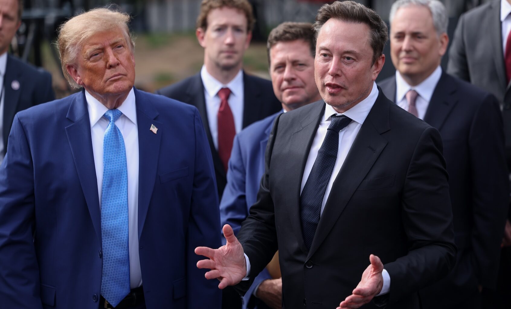 Tesla, X and SpaceX CEO Elon Musk speaks to reporters as President Donald Trump looks on outside the White House on Tuesday, Sept. 29, 2026 in Washington, D.C. Trump held a meeting on super intelligence earlier with tech CEOs in the East Room. (Tierney L. Cross/Pool/For The Washington Post via Getty Images)