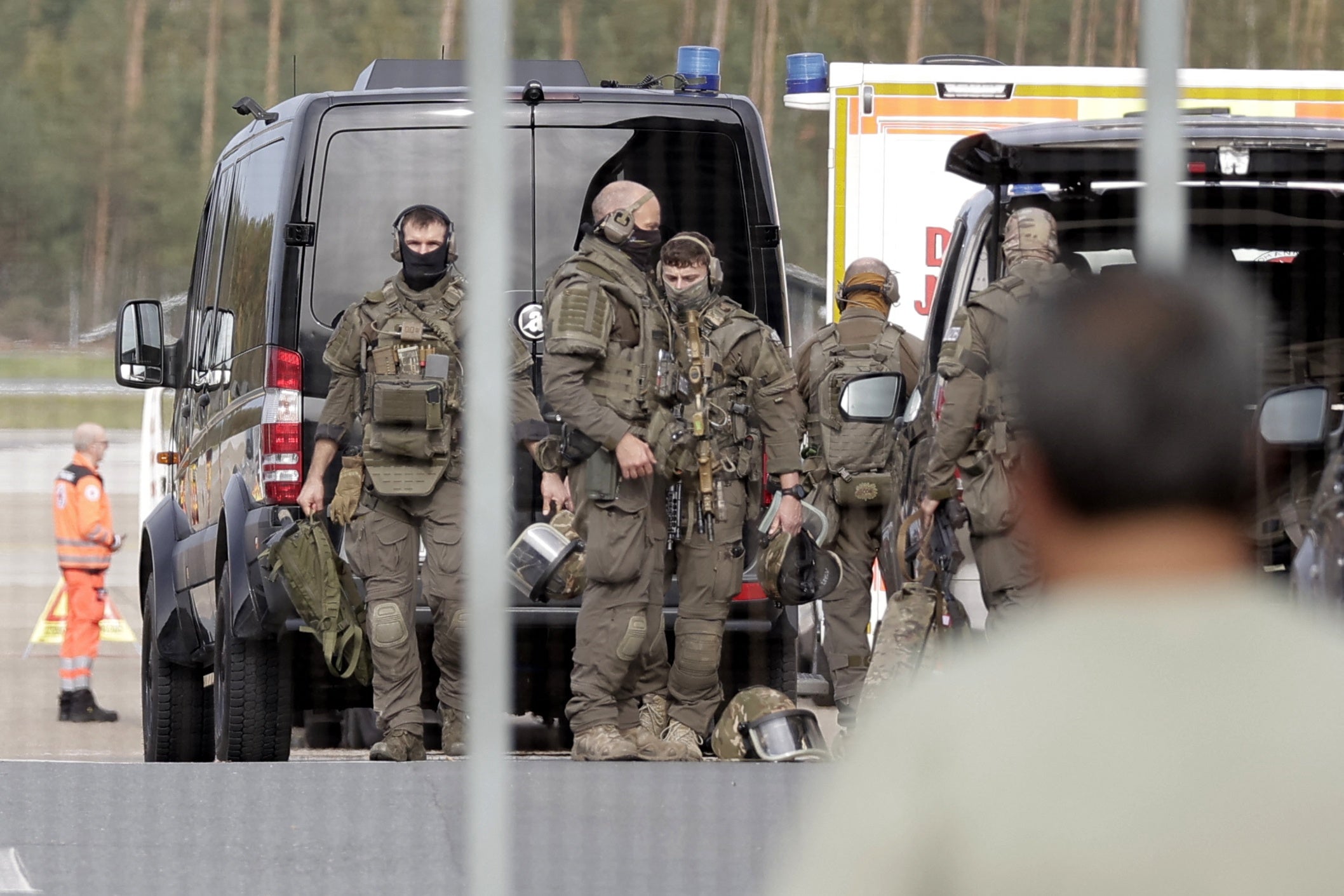 Members of a Police special operations unit (SEK) are on the move within the Nuremberg airport grounds in Nuremberg, Germany, Tuesday, Oct. 13, 2026.