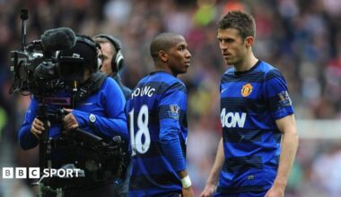 Michael Carrick and Manchester United team-mate Ashley Young on the pitch at Sunderland in 2012