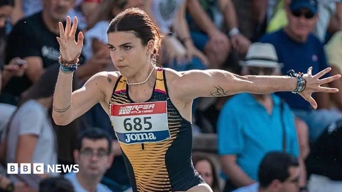 Julieta Gallego during a competition. She is a young woman wearing an athletics singlet.